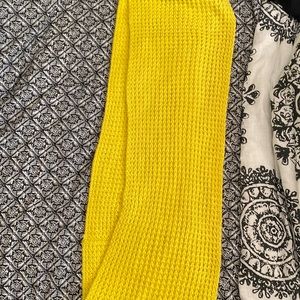 Warm yellow knit scarf. Small snag.